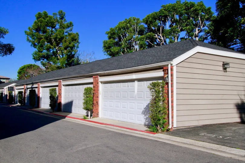THE HOUSE WITH CEMENT COLOUR ROOF AND SOME PLANTS ALSO BEHIND THE HOUSE SOME TREES ALSO AVAILABLE NEAR TO THE HOUSE.