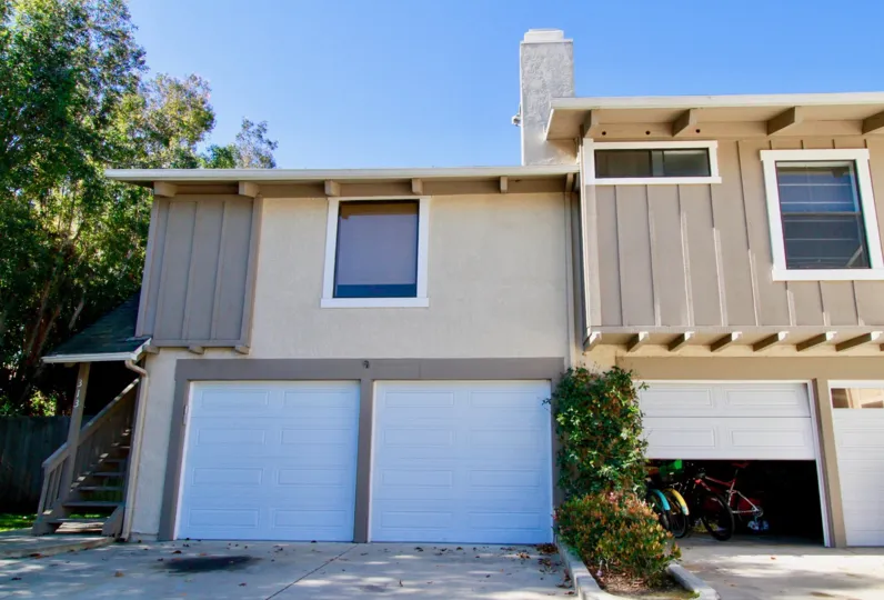 A building with trees and plants in the Peppertree Heights is nearby tree and plants and sheds.