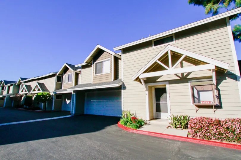 A sunny day in the Quiet Bay Townhomes is like a row houses and also with full residential area with trees plants, and sheds.