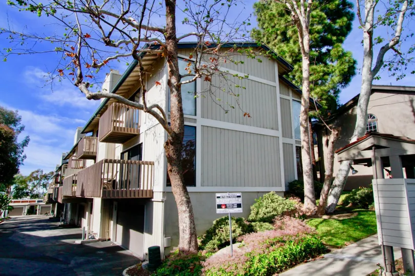 Villas having balconies and trees around with signboards in Sea Bluffs Condos of Costa Mesa