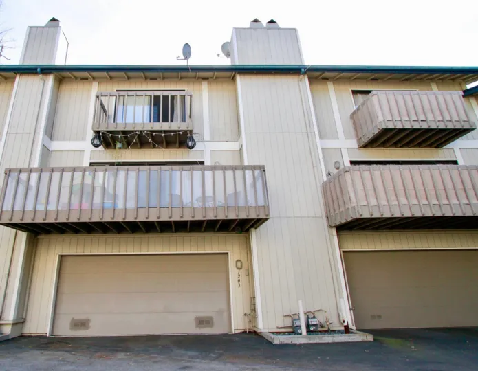 Sea Bluffs Condos Costa Mesa California light coloured painting with large balcony and pillars