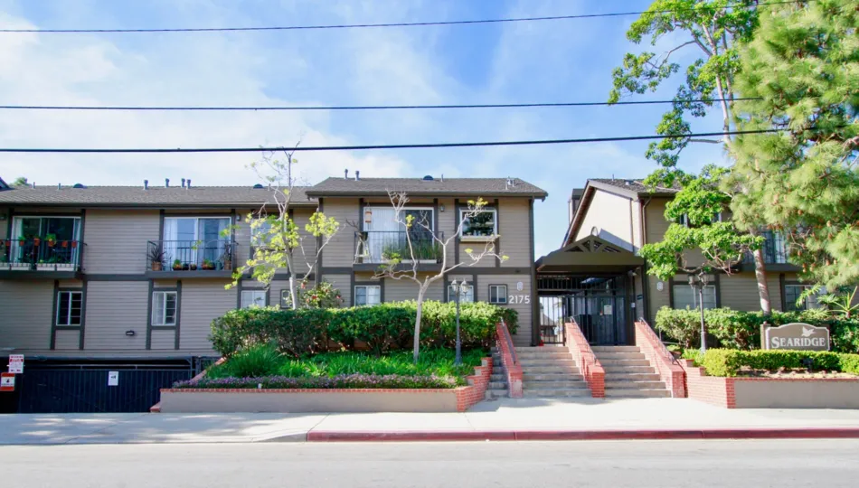 The houses in the sea ridge is like a row houses with trees, plants, steps and beautiful look