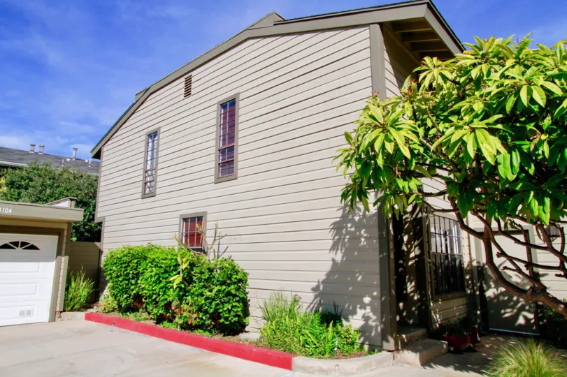 Spacious driveway outside of a well landscaped Sunset Bluffs home