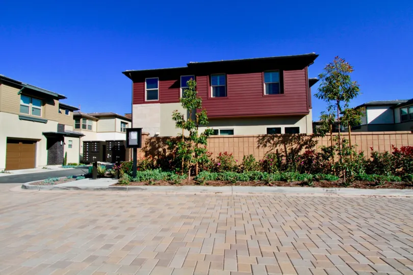 the red siding stands out against the blue sky at The Edge community