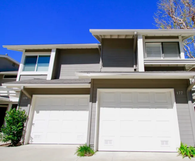 Beautiful entrance approach view of villa with parking place upstairs in The Village at Admiral Way of Costa Mesa