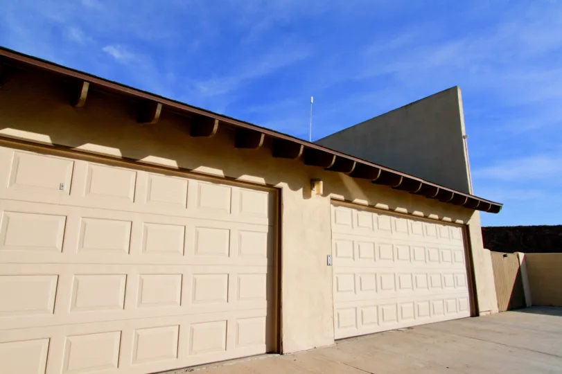 THE STORE ROOM OR BUILDING LOCATED ALONE AND A WALL AT THE FRONT AND THE SKY LOOKING SUNSHINE AT THE MORNING TIME.