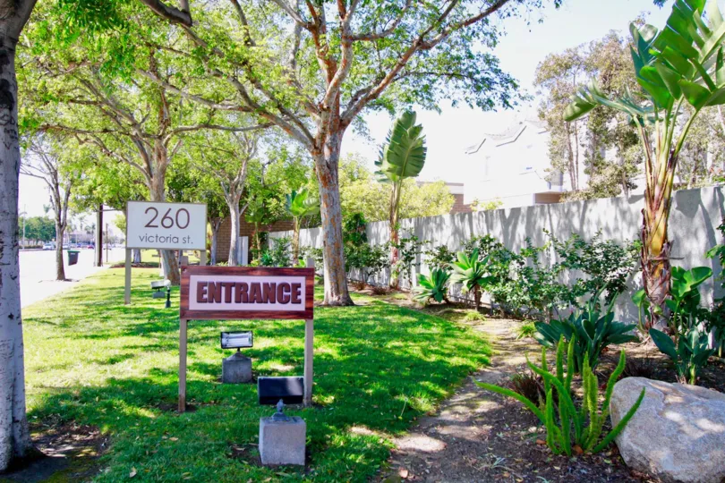 Victoria Garden Villas Costa Mesa California house fully coverd garden no house building front side entrance board attached