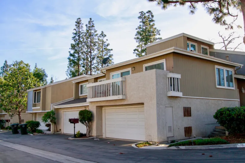 Village Creek Costa Mesa California building color light brown very looking huge window attached glass blue color