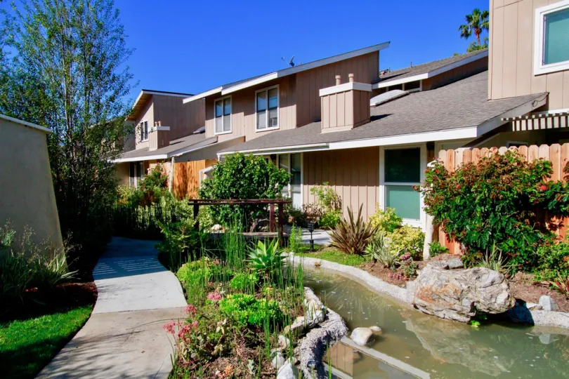 Excellent View of Villa with small stream of pond with trees in Woodstream Condos of Costa Mesa