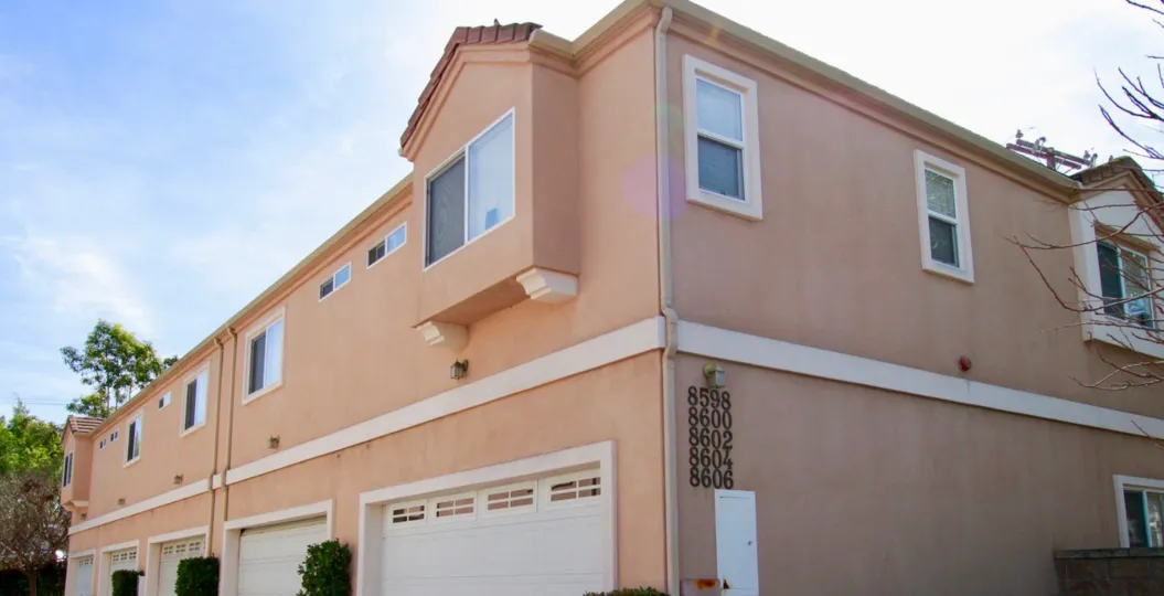 Beautiful pink apartment building in Belmont Grace community of Cypress, California