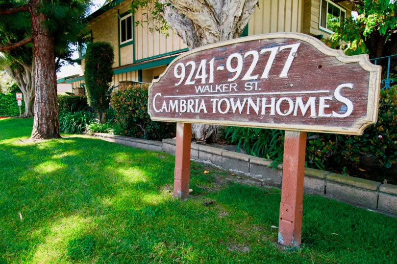 A unit block sign in the lawn of Cambria Townhomes in Cypress