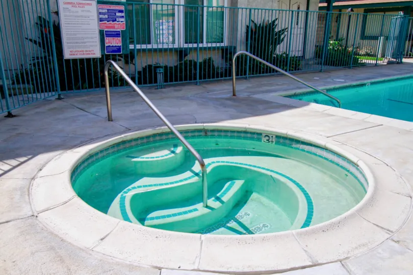 The hot tub and pool area of the Cambria Townhomes in Cypress