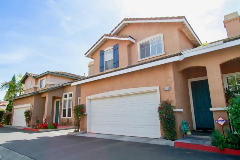 A two story house with a garage in Cypress Cottages
