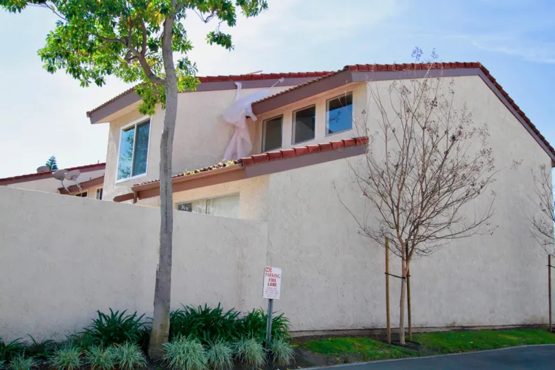 Cypress Villas Cypress California plain building with cool windows reflects sky color