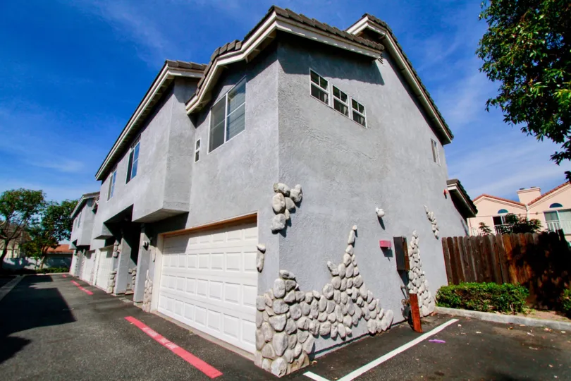 A sunny day in a two-floor gray house in the cypress West II neighborhood.