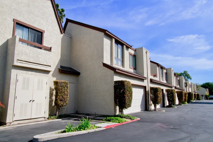 Front view of the Embassy Park Townhomes located in Cypress, California