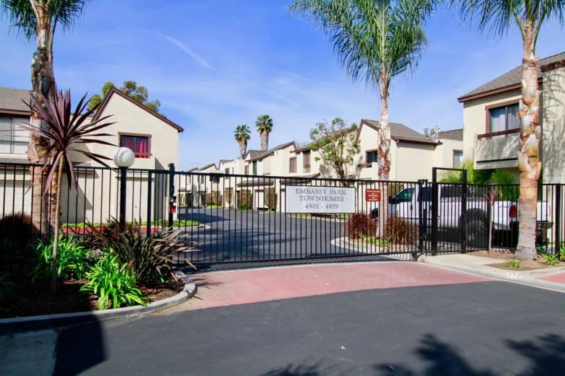 Fenced in townhomes surrounded by palmtrees in Ca.