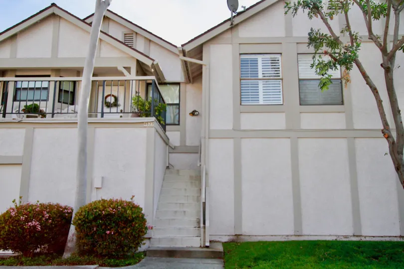 Townhomes with large steps leading to a deck in CA