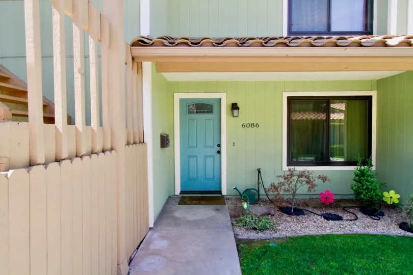 The front entrance of a home and walkway in Meadowbrook Cypress on a sunny day