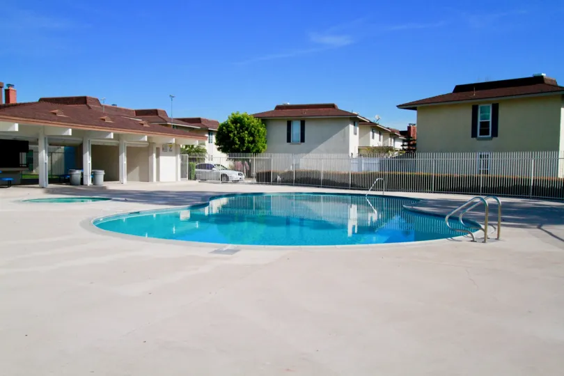 A beautiful house covered with swimming pool in front side