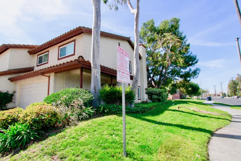 Palm Park Cypress California small buildings at sideview with long trees