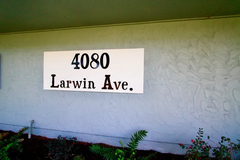 Tanglewood West Cypress California plain long wall with large sign board at front