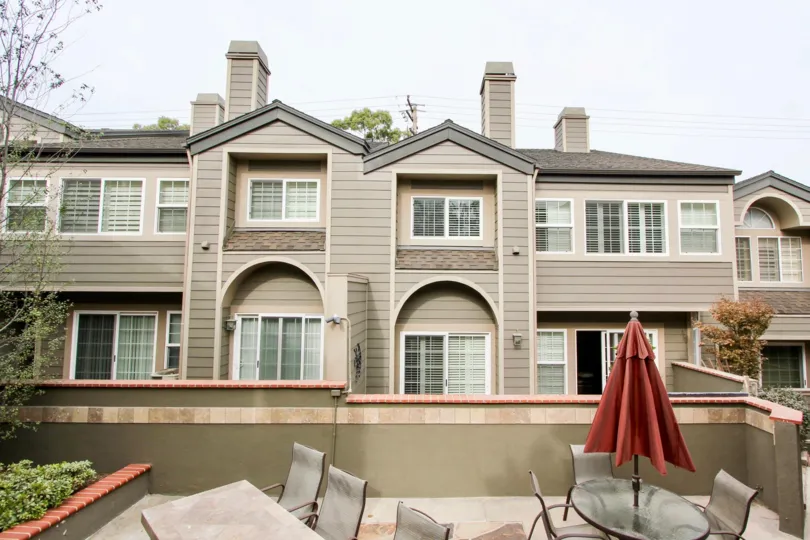 A great day in the Bluffside Villas with a umbrella and building.
