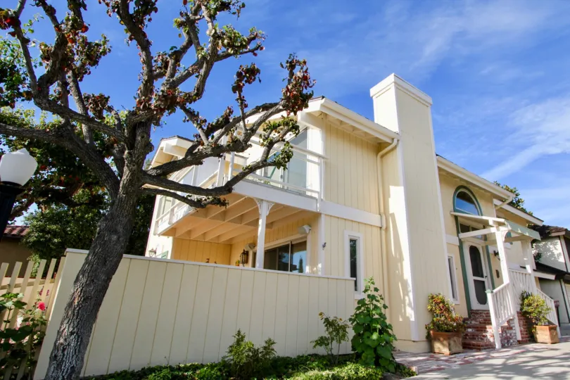 THE BUILDING IN THE CAMINO HEIGHTS WITH THE PLANTS, TREES, UPSTAIRS, THAR ROAD