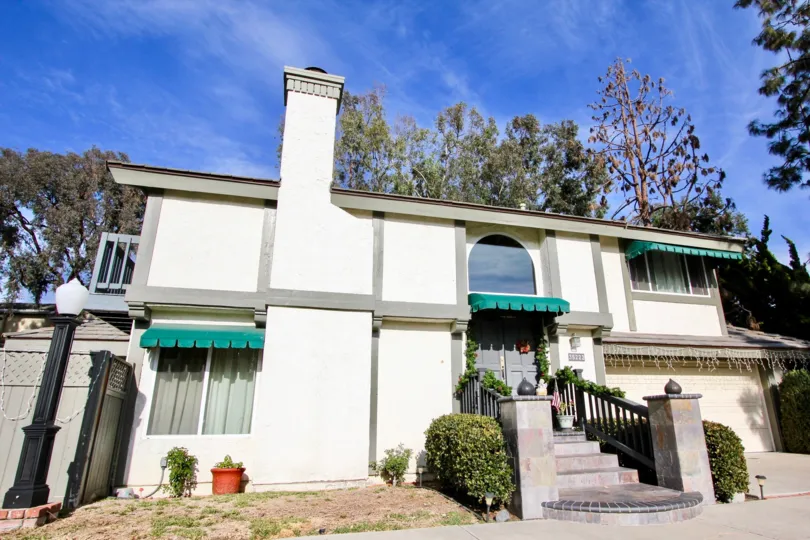 a sunny day in the camino heights with house that has front of garden in land post
