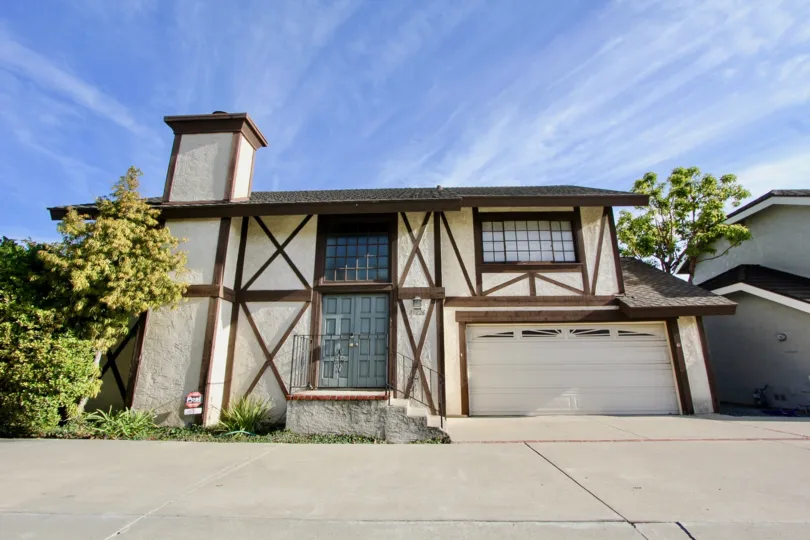 THE HOUSE WITH ATTACHED SHOP, IN THE CAMINO HEIGHTS WITH THE STEPS, TREES
