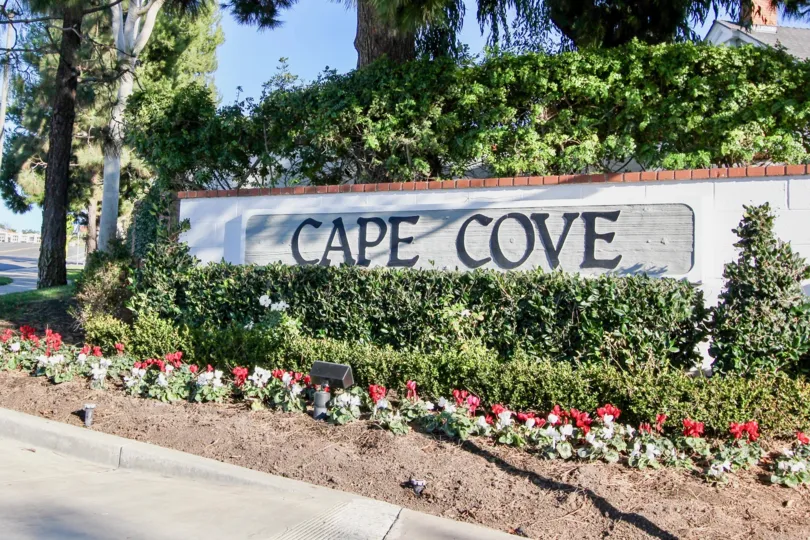 a sunny day in the cape cove with a compound wall that is named with it s community