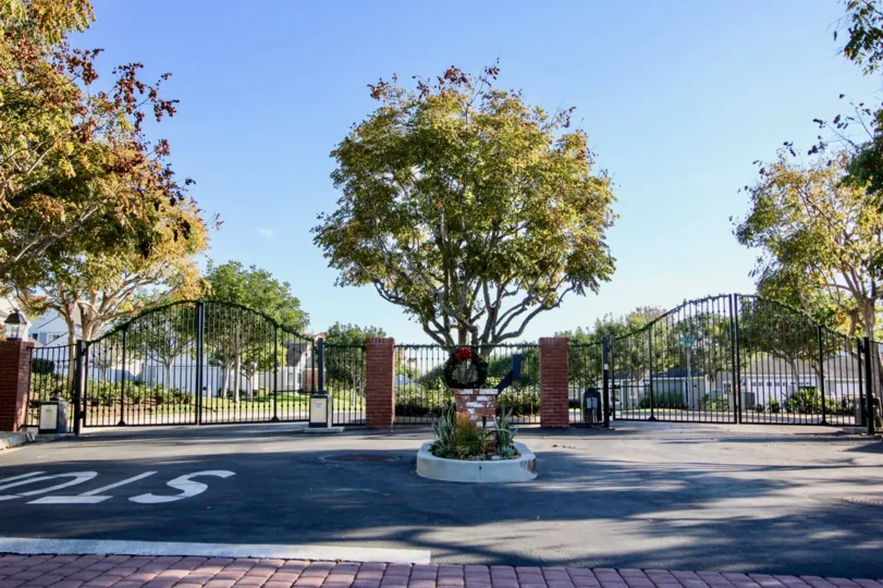 A sunny day in the Cape Cove with two gates and trees.