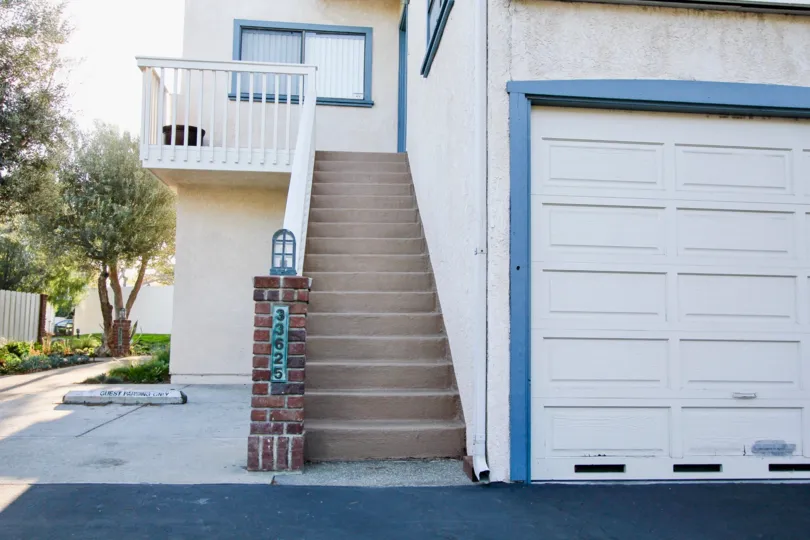a warm day in the dana light l with house that has steps and white door