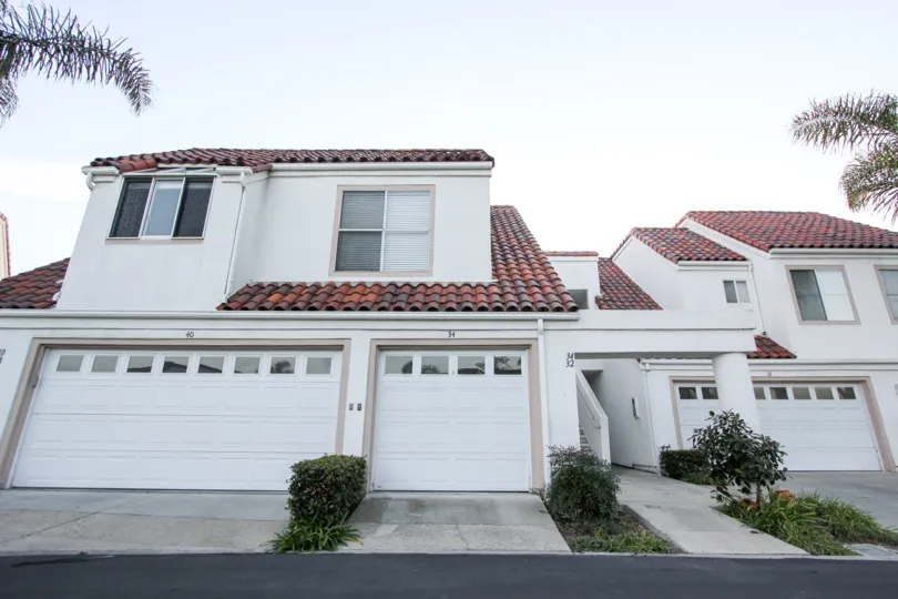 a warm day in the encantamar with house that has door in white and roof in top