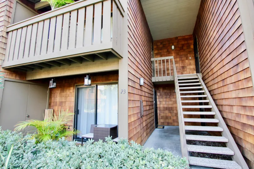 THE 23RD BUILDING IN THE HARBOR CREEK WITH THE UPSTAIRS, PLANTS, TREES, BALCONIS