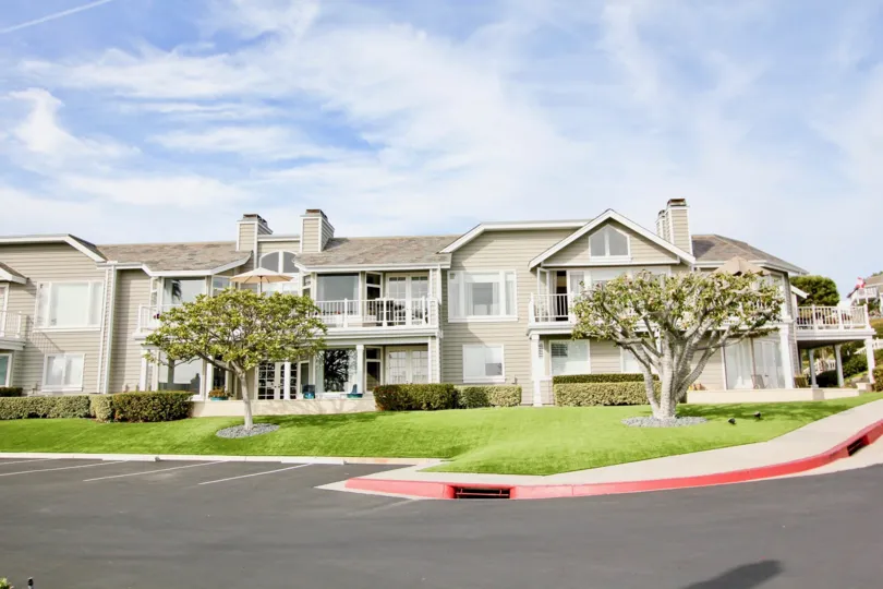 Front to the Villa's in Lantern Bay Villas has meadow place with trees