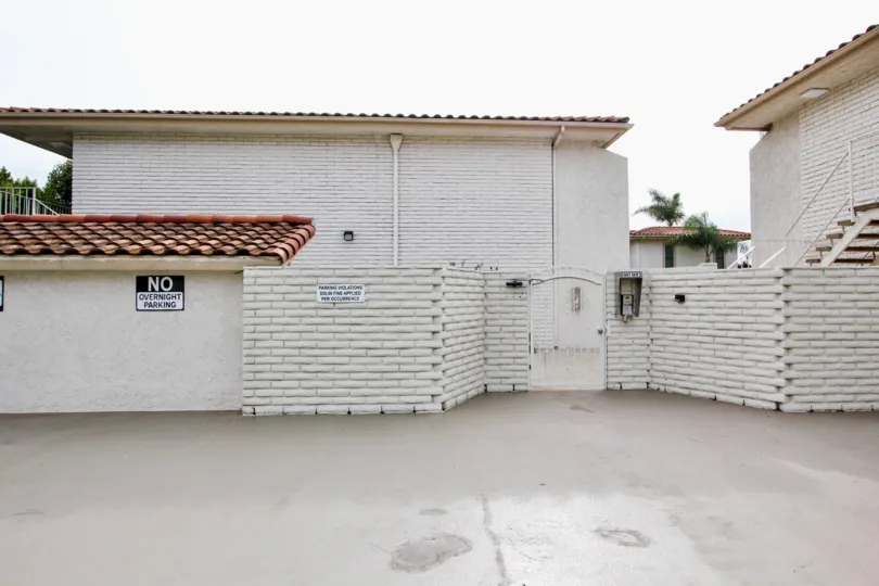 a warm dayin the Las Mariannas with house that has stone walls in white and top of roof