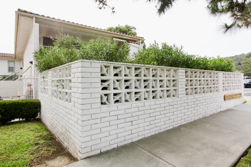 a warm day in the Las Mariannas with house that has stone walls on top in garden