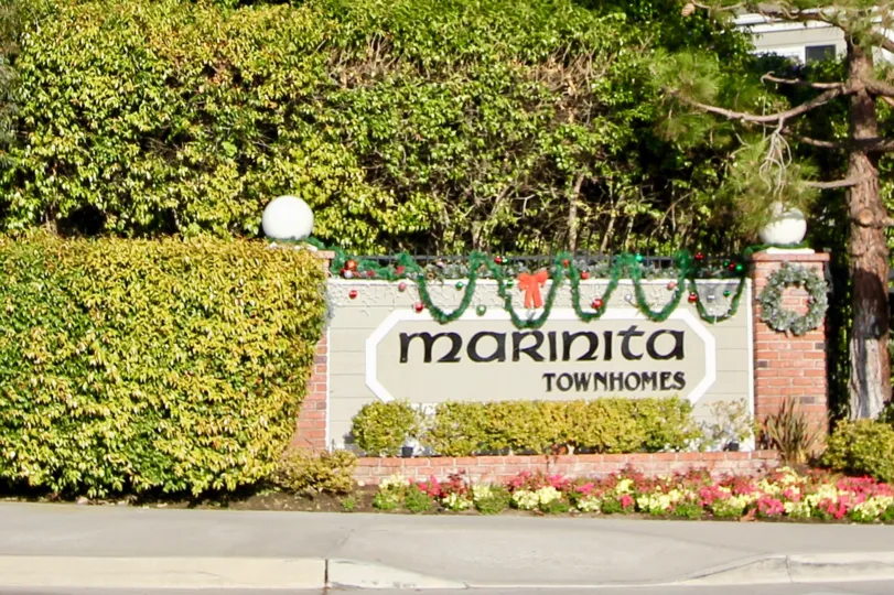 a sunny day in the marinita townhomes with house that has entrance of garden and 2 lights