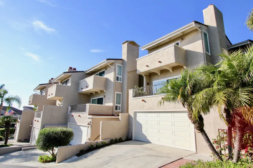 a warm day in the monarch bay villas with house that has closed parking door and glass window