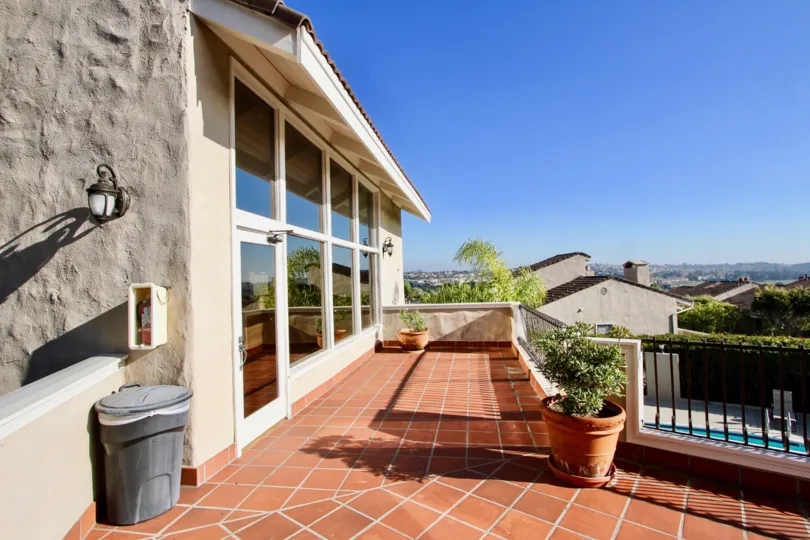 A beautiful day in the Monarch Bay Villas with a plant pot and floor tile.