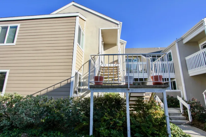 A sunny day in the Niguel Beach Terrace with a balcony and steps.
