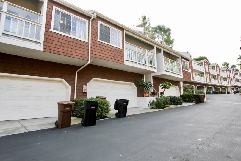 THE BUNGALOW IN THE PACIFIC TERRACE WITH THE BALCONIS, SHUTTERS, DUSTBINS