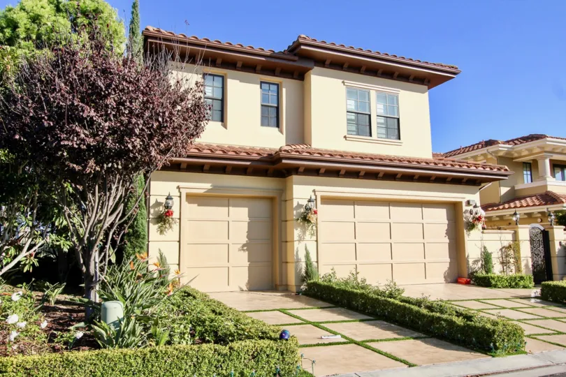 Front open space with driveway and garge doors of Pointe Monarch community, Dana Point, CA