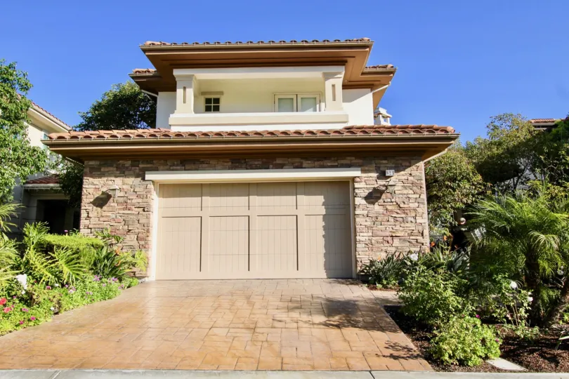a sunny day in the pointe monarch with a building that has roofless top and stonny walls
