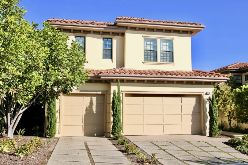 a sunny day in the pointe monarch with house that has 2 sandle doors and roofless top in window