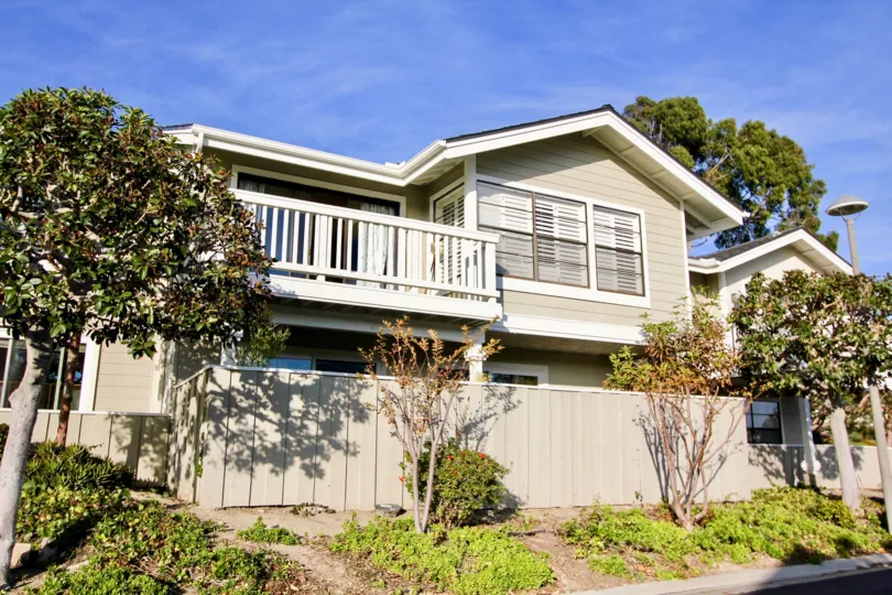 Front of the House in sea ridge has bushes and plants with flowers