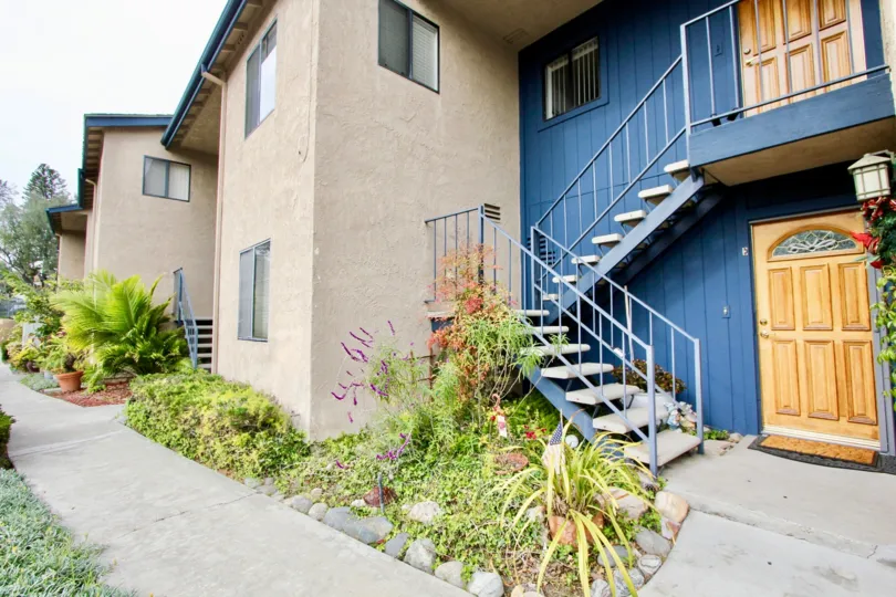 A day in the Sea View Condos with a stair case and wooden door.