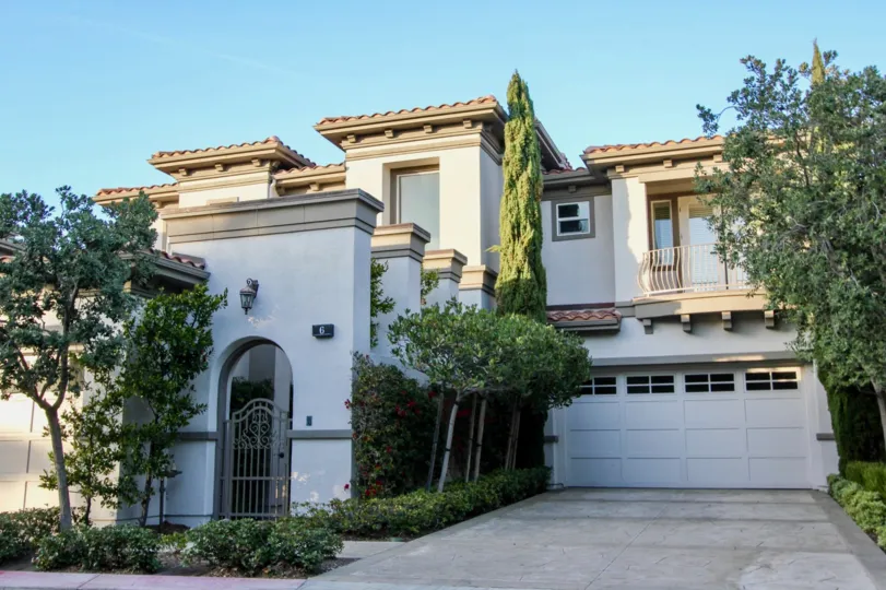 a warm day in the sea villas at st. regis with house that has glass window and parking door