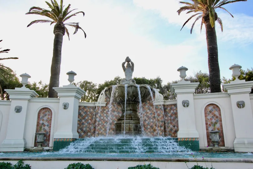 A sunny day in the Sea Villas at St. Regis with a sculpture on a water fountain.